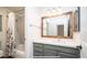 Bathroom with a shower/tub combo, modern vanity, and a framed mirror at 4417 E Rancho Caliente Dr, Cave Creek, AZ 85331