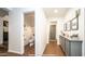 Clean hallway bathroom with toilet, cabinet, and wood flooring at 4417 E Rancho Caliente Dr, Cave Creek, AZ 85331