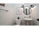 Stylish powder room with pedestal sink, mirror, and modern fixtures at 4417 E Rancho Caliente Dr, Cave Creek, AZ 85331