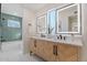 Modern bathroom with double vanity, herringbone tile, and updated fixtures at 4437 N Granite Reef Rd, Scottsdale, AZ 85251