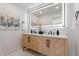 Modern bathroom with a double vanity and large mirror at 4437 N Granite Reef Rd, Scottsdale, AZ 85251