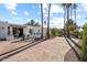 Landscaped front yard with palm trees and a long driveway leading to the house at 4437 N Granite Reef Rd, Scottsdale, AZ 85251