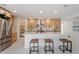 Modern kitchen with light wood cabinets, white countertops, and island with seating at 4437 N Granite Reef Rd, Scottsdale, AZ 85251