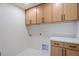 Bright laundry room with ample cabinetry and countertop space at 4437 N Granite Reef Rd, Scottsdale, AZ 85251