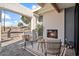 Outdoor patio area with a fireplace and seating, overlooking the street at 4437 N Granite Reef Rd, Scottsdale, AZ 85251