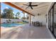 Covered patio with dining area overlooking the refreshing pool at 4437 N Granite Reef Rd, Scottsdale, AZ 85251