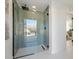 Walk-in shower with herringbone-patterned tile and glass enclosure at 4437 N Granite Reef Rd, Scottsdale, AZ 85251