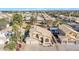 Expansive aerial view of a Southwestern home with a tile roof, mature trees, and manicured landscaping at 4968 E Grandview Rd, Scottsdale, AZ 85254