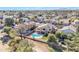 Scenic aerial view of a neighborhood featuring Southwestern homes, mature trees, and community pools at 4968 E Grandview Rd, Scottsdale, AZ 85254