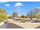 Expansive backyard featuring green grass, trees, and fence line at 4968 E Grandview Rd, Scottsdale, AZ 85254