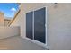 Balcony featuring neutral stucco, outdoor light, and door at 4968 E Grandview Rd, Scottsdale, AZ 85254