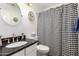 Clean bathroom with granite countertop and shower at 4968 E Grandview Rd, Scottsdale, AZ 85254