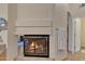 Well lit bathroom including a fireplace, door, and towel rack at 4968 E Grandview Rd, Scottsdale, AZ 85254