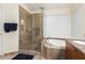 Bathroom with a large walk-in shower and soaking tub at 4968 E Grandview Rd, Scottsdale, AZ 85254