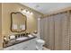 Bathroom featuring a large sink, decorative mirror, shower, and toilet at 4968 E Grandview Rd, Scottsdale, AZ 85254