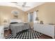 Guest bedroom with white furniture and checkerboard rug at 4968 E Grandview Rd, Scottsdale, AZ 85254