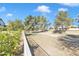 Picturesque walking path surrounded by lush trees in a Gathering-friendly community at 4968 E Grandview Rd, Scottsdale, AZ 85254