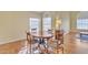 Dining area featuring a wood table with chairs and natural light from the arched windows at 4968 E Grandview Rd, Scottsdale, AZ 85254