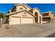 Two-story house with three-car garage and drought-tolerant landscaping at 4968 E Grandview Rd, Scottsdale, AZ 85254