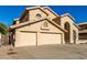 Two-story house with three-car garage and neat desert landscaping at 4968 E Grandview Rd, Scottsdale, AZ 85254