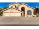 Two-story house with three-car garage and landscaped yard at 4968 E Grandview Rd, Scottsdale, AZ 85254