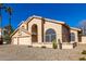 Two-story house with three-car garage and mature desert landscaping at 4968 E Grandview Rd, Scottsdale, AZ 85254