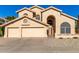 Two-story house with three-car garage and desert landscaping at 4968 E Grandview Rd, Scottsdale, AZ 85254