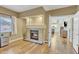 Room featuring a fireplace, hardwood flooring, and a doorway leading into another room at 4968 E Grandview Rd, Scottsdale, AZ 85254