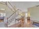 Foyer featuring a staircase, desk, and a doorway leading into a dining room at 4968 E Grandview Rd, Scottsdale, AZ 85254