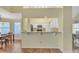 Well-lit kitchen featuring white cabinets, granite countertops, and stainless steel appliances at 4968 E Grandview Rd, Scottsdale, AZ 85254