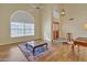 Bright living room featuring a large window, wood floors, and contemporary decor at 4968 E Grandview Rd, Scottsdale, AZ 85254