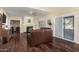 Living room with sliding doors to backyard and leather couches at 4968 E Grandview Rd, Scottsdale, AZ 85254