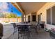 Covered patio with seating area and pool view at 4968 E Grandview Rd, Scottsdale, AZ 85254