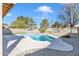 Inviting backyard pool area with a unique shape, gravel surround, and blue water at 4968 E Grandview Rd, Scottsdale, AZ 85254