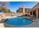 Inviting kidney-shaped pool with surrounding patio at 4968 E Grandview Rd, Scottsdale, AZ 85254