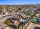 Aerial view of single-story house with pool, solar panels, and desert landscaping at 5109 E Blanche Dr, Scottsdale, AZ 85254