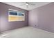 Cozy bedroom with light purple walls and ceiling fan at 5109 E Blanche Dr, Scottsdale, AZ 85254