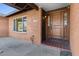 Front door entry with tile flooring and brick facade at 5109 E Blanche Dr, Scottsdale, AZ 85254