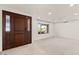 Spacious living room with large window and neutral carpeting at 5109 E Blanche Dr, Scottsdale, AZ 85254