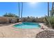 Inviting kidney-shaped pool with surrounding landscaping at 5109 E Blanche Dr, Scottsdale, AZ 85254