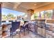 Outdoor kitchen with grill, stone counters, and seating at 5122 E Shea Blvd # 1029, Scottsdale, AZ 85254