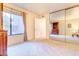 Bright bedroom with mirrored closet doors and neutral decor at 5122 E Shea Blvd # 1029, Scottsdale, AZ 85254