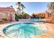 Community hot tub with surrounding patio seating at 5122 E Shea Blvd # 1029, Scottsdale, AZ 85254