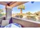 Private patio with a table and chairs overlooking the golf course at 5122 E Shea Blvd # 1029, Scottsdale, AZ 85254