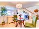 Dining area with a round glass table and green chairs at 5122 E Shea Blvd # 1030, Scottsdale, AZ 85254