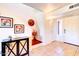 Interior entryway with tiled floor, built-in shelving, and a mirrored cabinet at 5122 E Shea Blvd # 1030, Scottsdale, AZ 85254