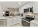 Modern kitchen with white shaker cabinets and marble countertops at 5505 E Mclellan Rd # 99, Mesa, AZ 85205