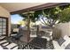 Covered patio with seating area and view of lush trees at 5505 E Mclellan Rd # 99, Mesa, AZ 85205