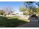 Community pool area with grassy lawn and gazebo at 5505 E Mclellan Rd # 99, Mesa, AZ 85205