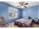 Cozy bedroom with ceiling fan and window blinds at 553 S Meadows Dr, Chandler, AZ 85224